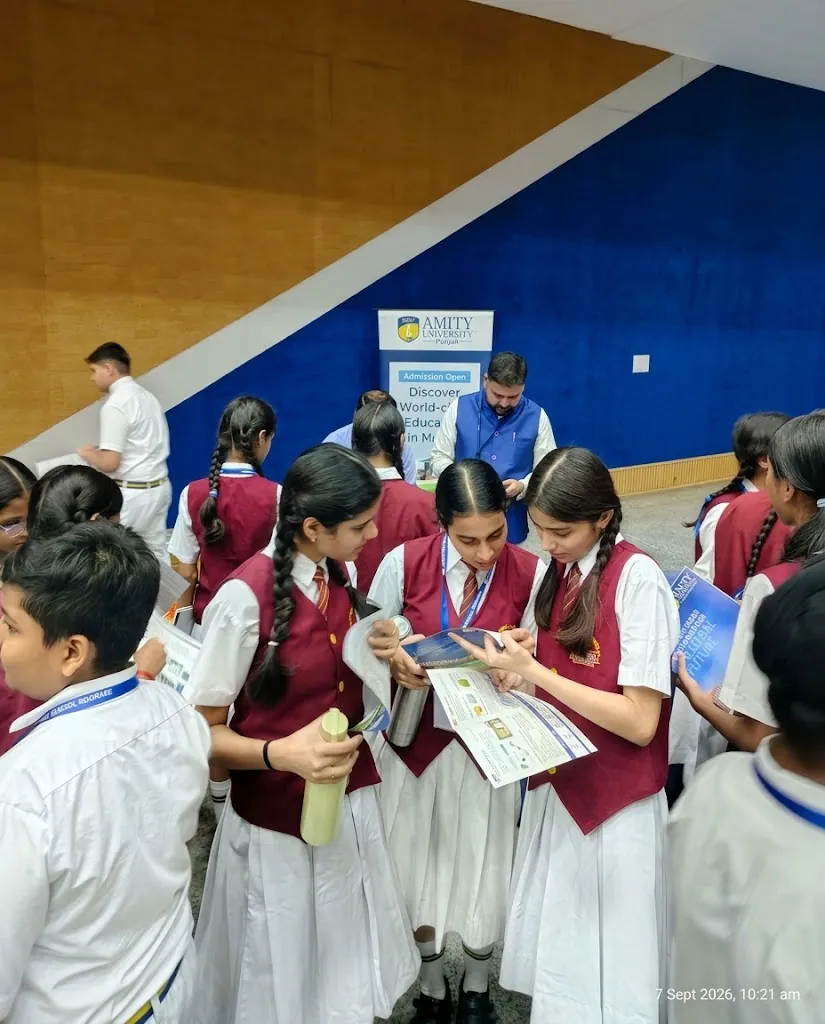 Students reviewing career pathways and university brochures